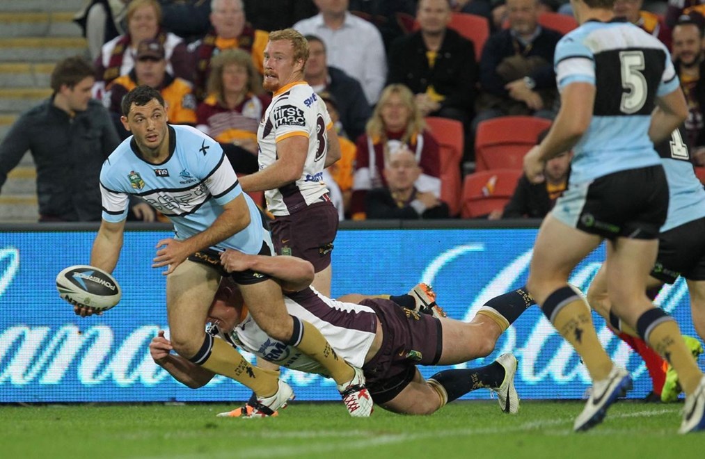Photo by Colin Whelan copyright Â© nrlphotos.com :       Jono Wright looks to pass as he is tackled by Ben hannant                        NRL Rugby League, Round 16 Brisbane Broncos v Cronulla Sharks at Suncorp Stadium, Friday June 27th 2014.