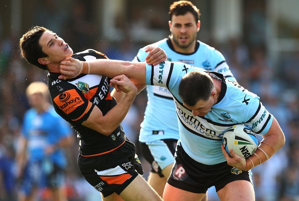 Paul Gallen of the Sharks and Mitchell Moses of the Tigers during the Round 24 NRL match between the Cronulla Sutherland Sharks and Wests Tigers at Remondis Stadium on August 16, 2015 in Canberra, Australia. Digital Image by Mark Nolan.