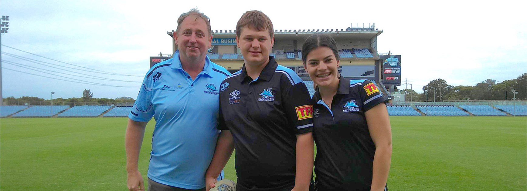 From left, Sharks Stars program manager Brendon Coombes, client Harry and program assistant Isabella