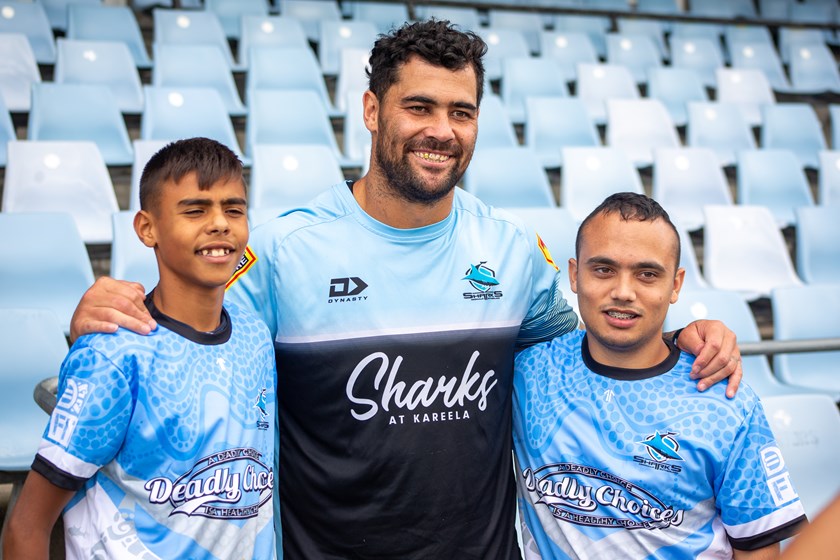 Andrew Fifita with two youngsters involved in the Sharks Deadly Choices program 