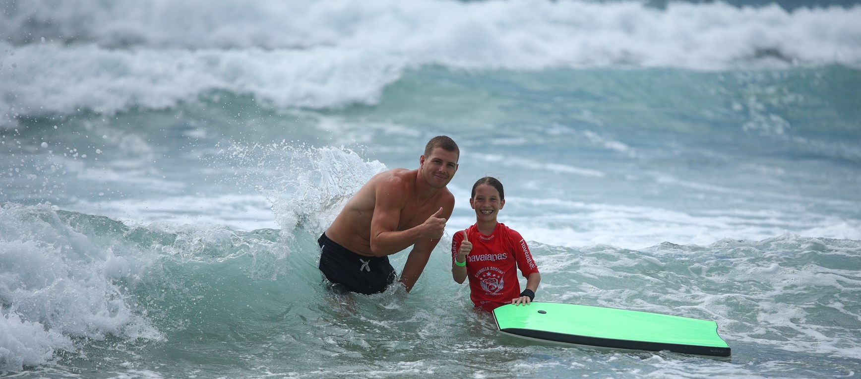 Sharks take over beach for Footy and Surf clinic