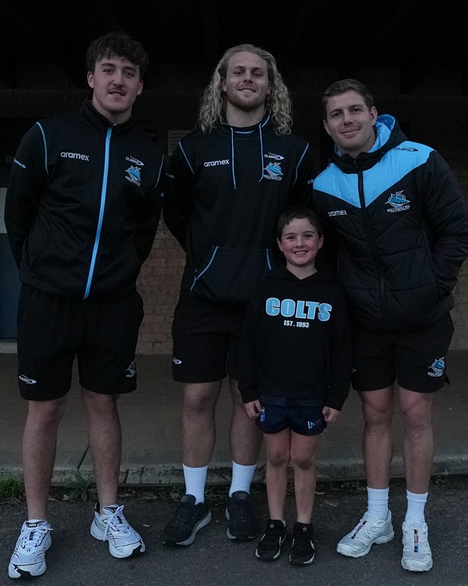 Nikora Williams, Sam McCulloch and Blayke Brailey with a Colts junior.