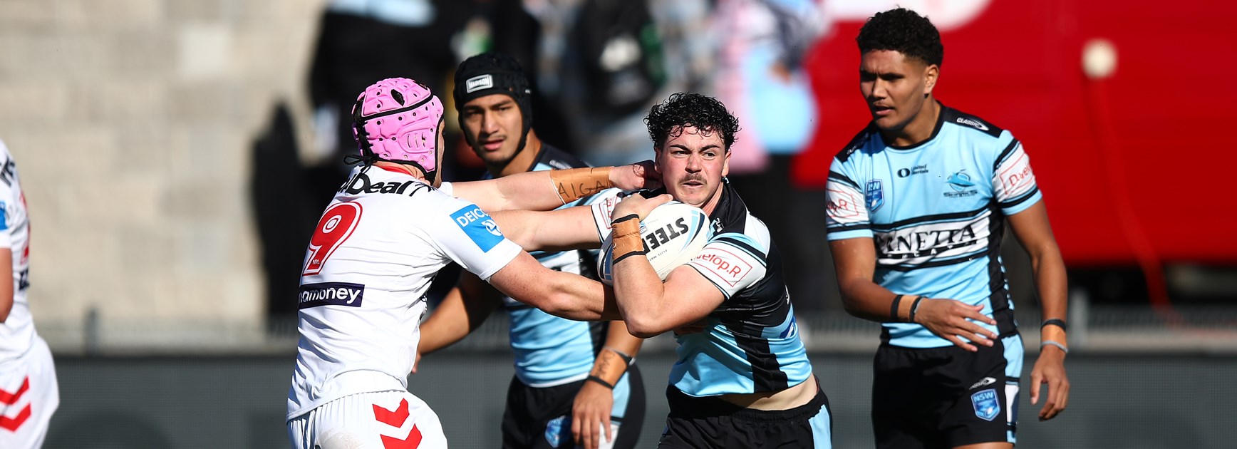 Flegg Sharks power to victory over ladder-leading Dragons.
