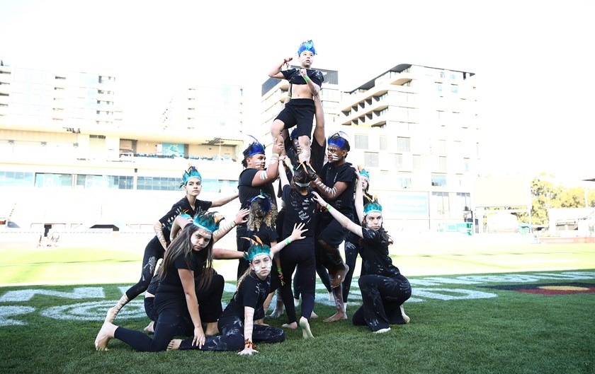 The Kurranulla Aboriginal Corporation Dance Group performing at the Sharks round 6 NRLW game.