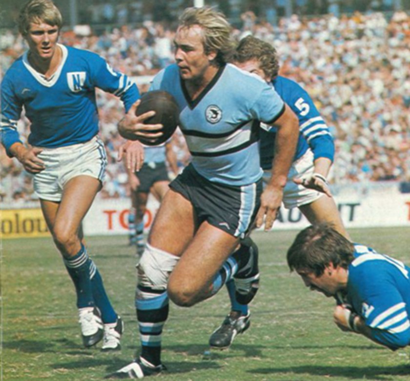 The Rock running through Newtown defenders in 1977.